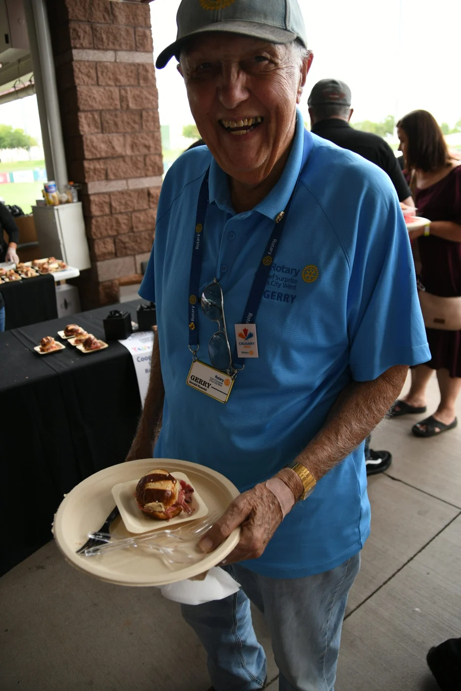 A guest enjoying a food sample at a previous festival